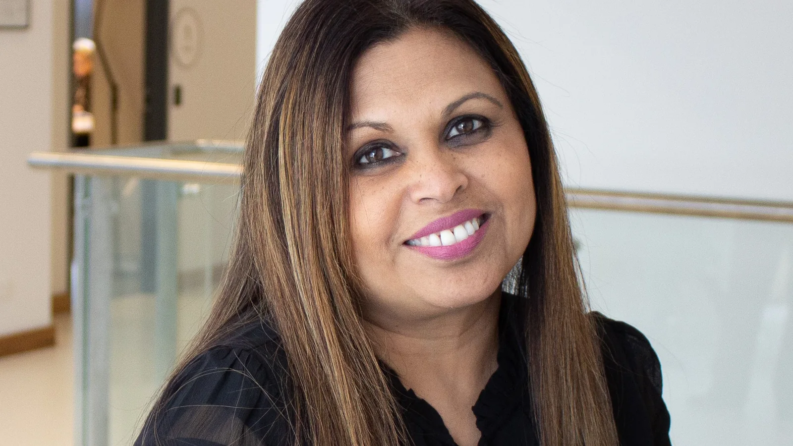 Dr Paula Rebeiro in a professional consulting setting